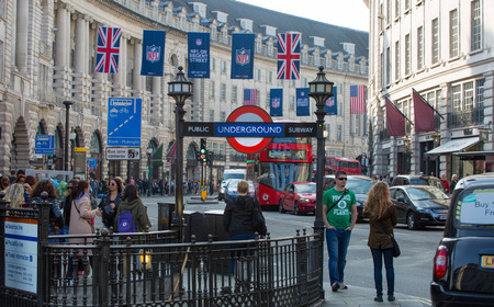 58860339 - london, uk - october 4, 2015: underground entrance at the regent street and lots of people and cars on the road
